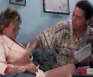 young doctor touching a  57 years old granny