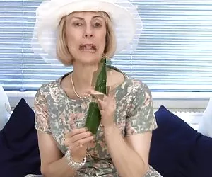 Mature housewife fucks a cucumber